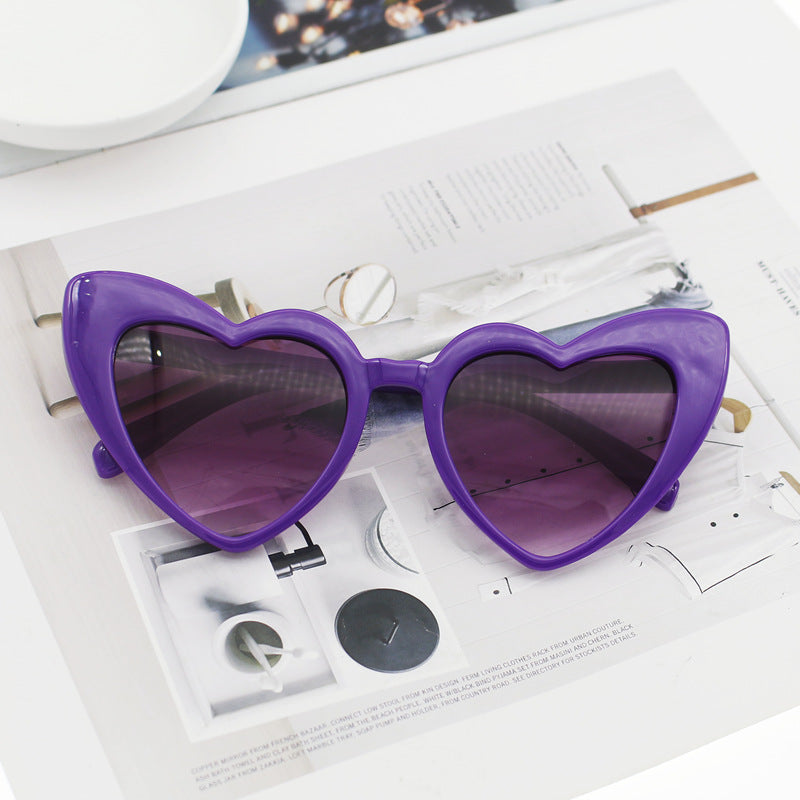 Women's sparkling heart-shaped sunglasses, a trendy summer fashion accessory with reliable UV protection.