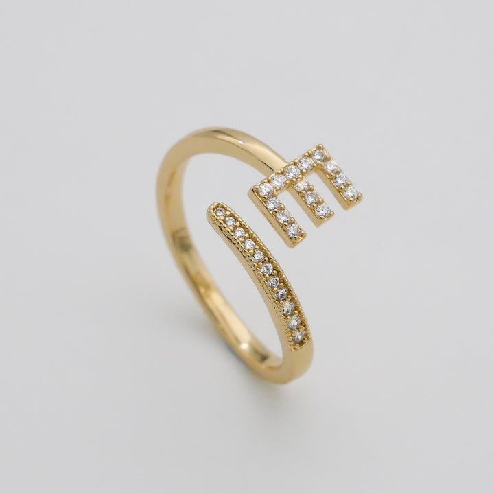 Sparkling pave initial women's ring, silver tone, adjustable for a snug fit.
