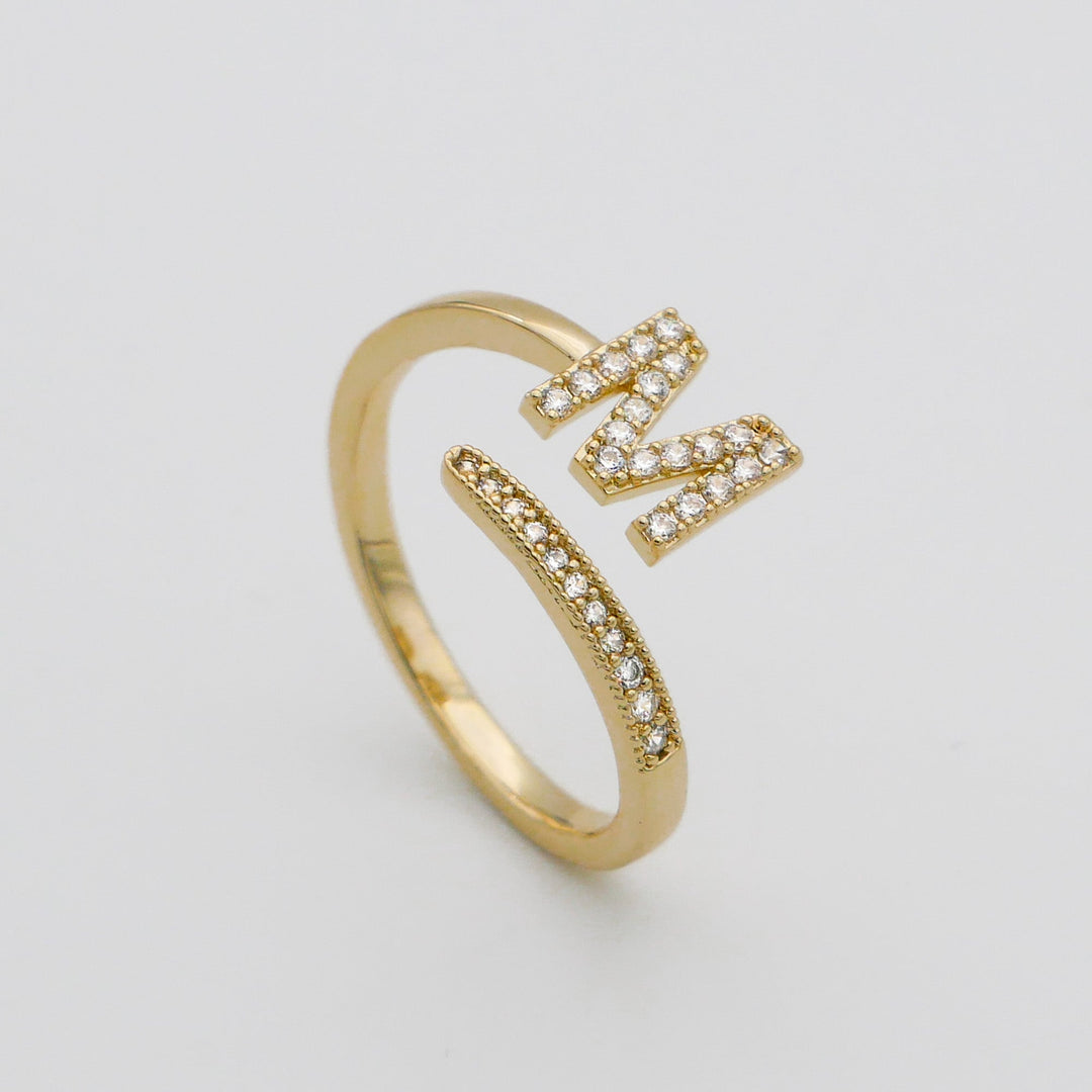 Personalized gold plated adjustable ring with a sparkling pave initial.