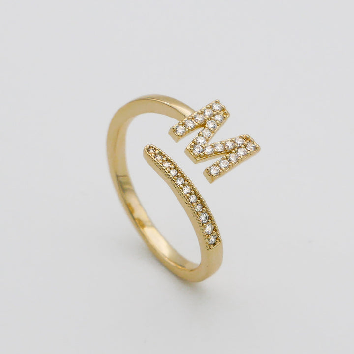 Personalized gold plated adjustable ring with a sparkling pave initial.
