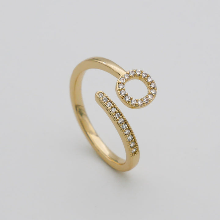 Women's custom initial ring, adjustable, gold plated, with pave detailing.