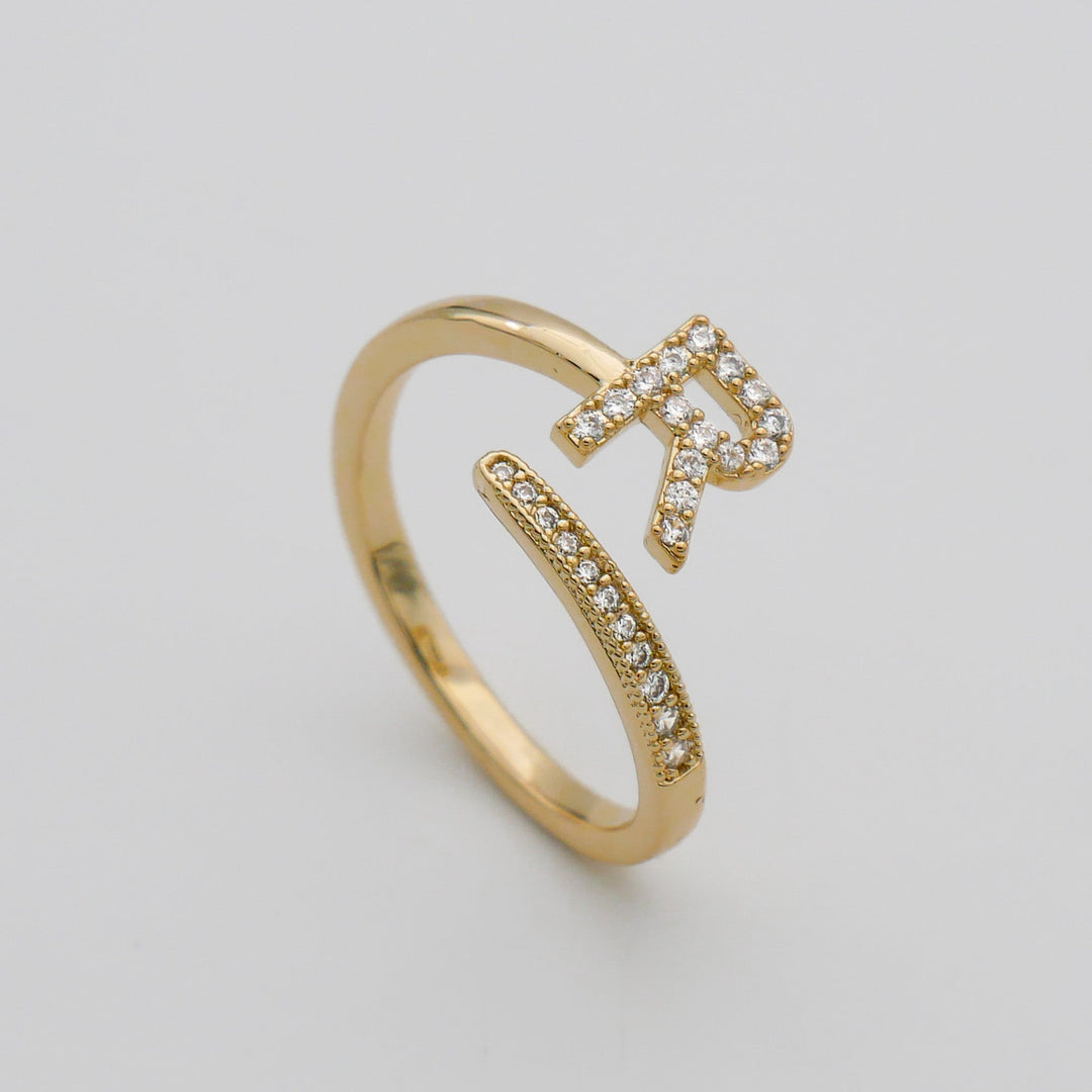 Silver plated adjustable initial ring, pave embellished, for everyday elegance.