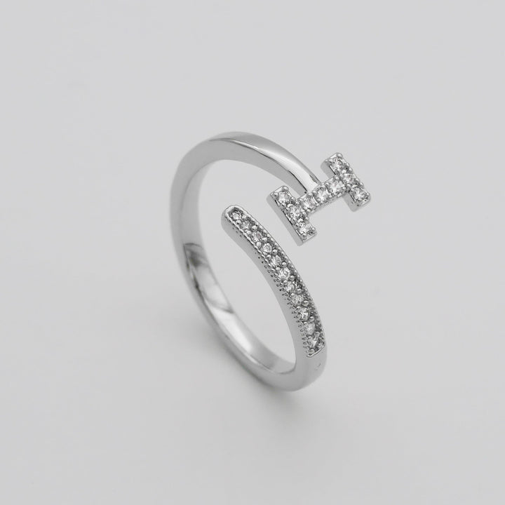Custom pave letter ring, adjustable, silver tone, perfect for women's style.