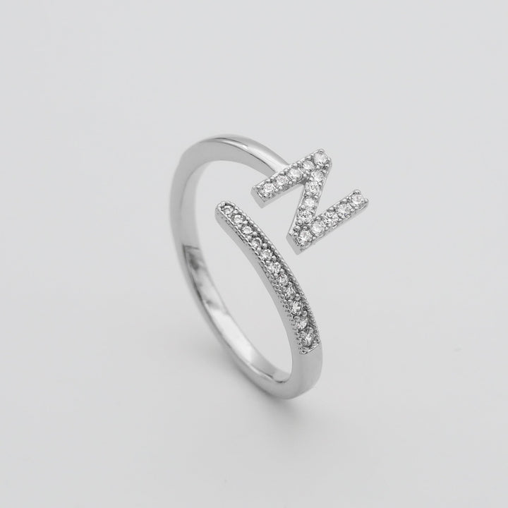 Women's adjustable ring, gold plated, featuring a custom pave initial.