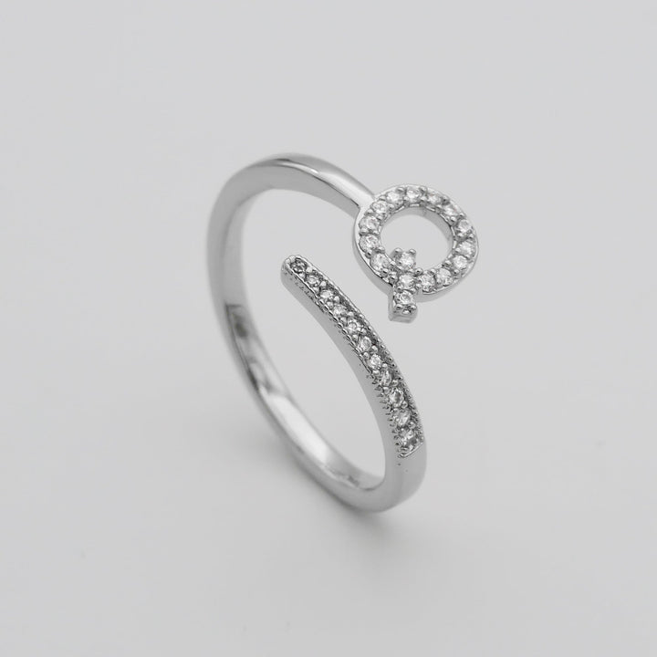 Silver plated adjustable initial ring with pave stones, personalized touch.