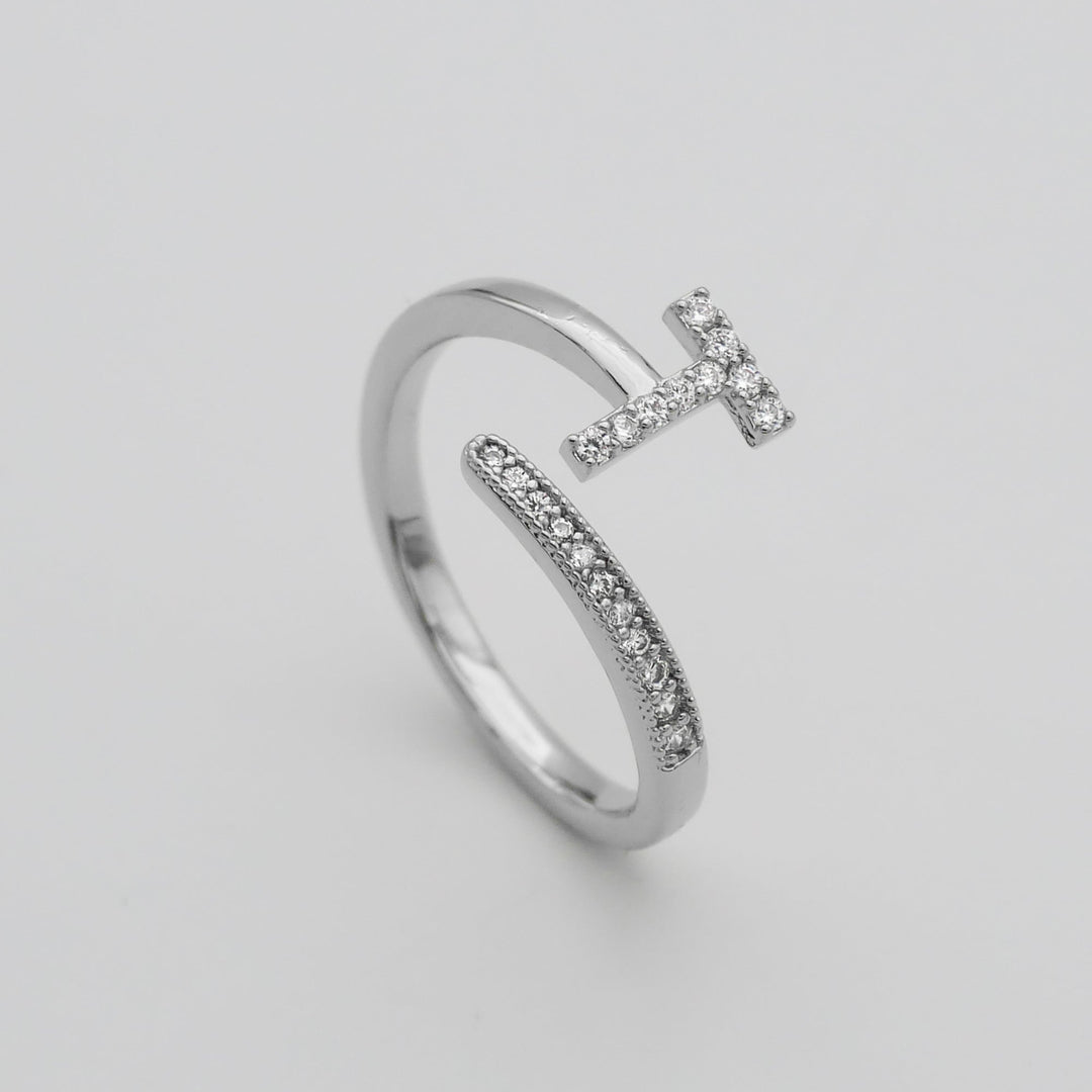 Gold plated adjustable ring with a prominent pave initial, women's custom piece.