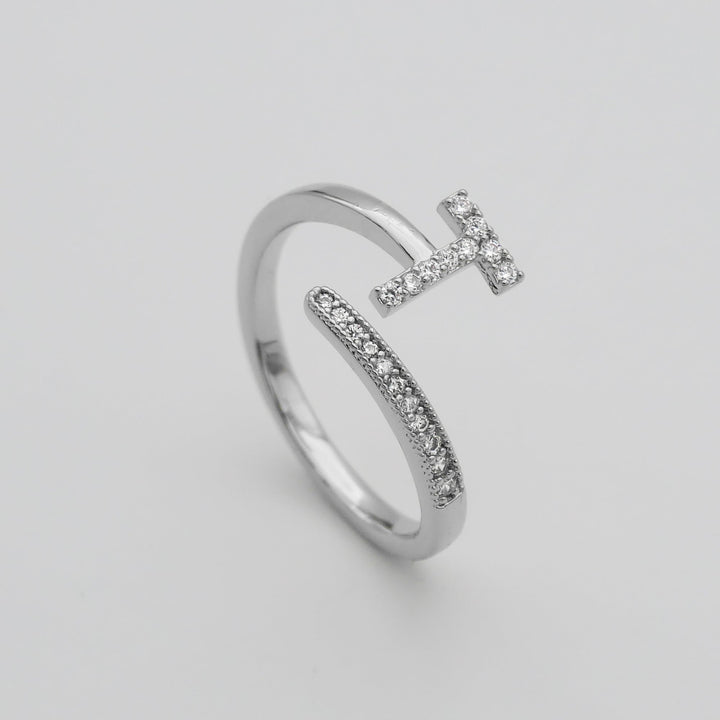 Gold plated adjustable ring with a prominent pave initial, women's custom piece.
