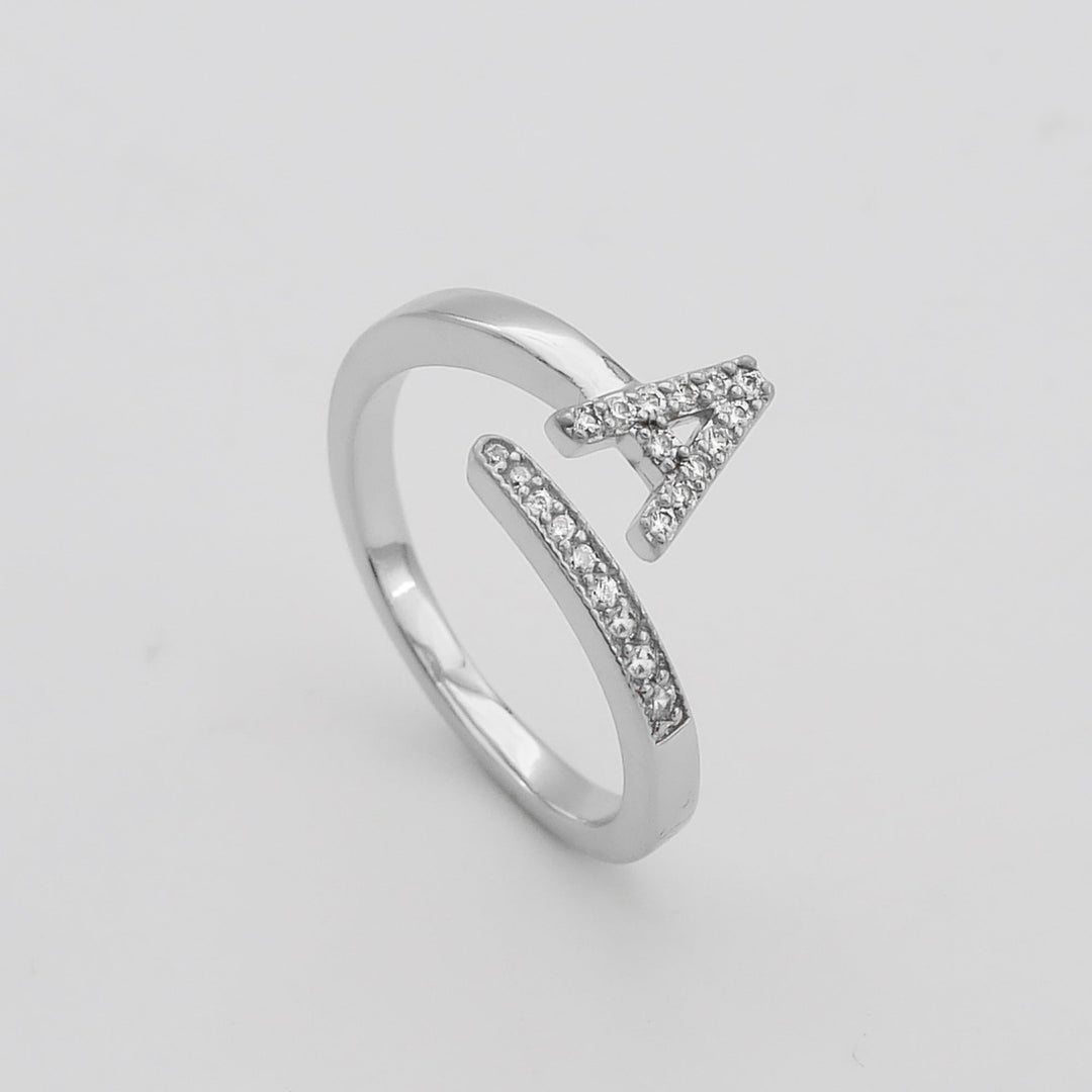 Silver plated personalized pave initial ring, adjustable for comfort and style.