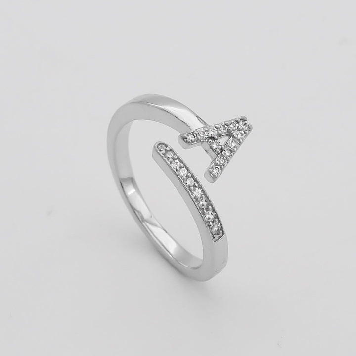 Silver plated personalized pave initial ring, adjustable for comfort and style.