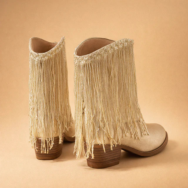 Pointed toe women's fringe ankle boots in gold with a block heel, ideal for a party or western look.