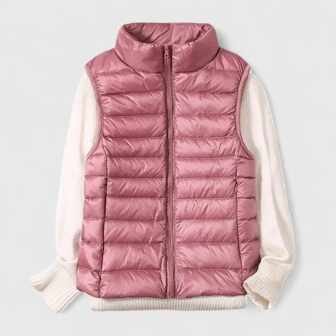 Stylish women's sleeveless puffer gilet; Grace brand, ideal for casual wear and warmth.
