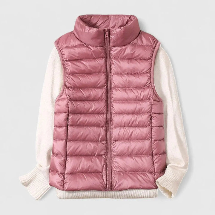 Stylish women's sleeveless puffer gilet; Grace brand, ideal for casual wear and warmth.