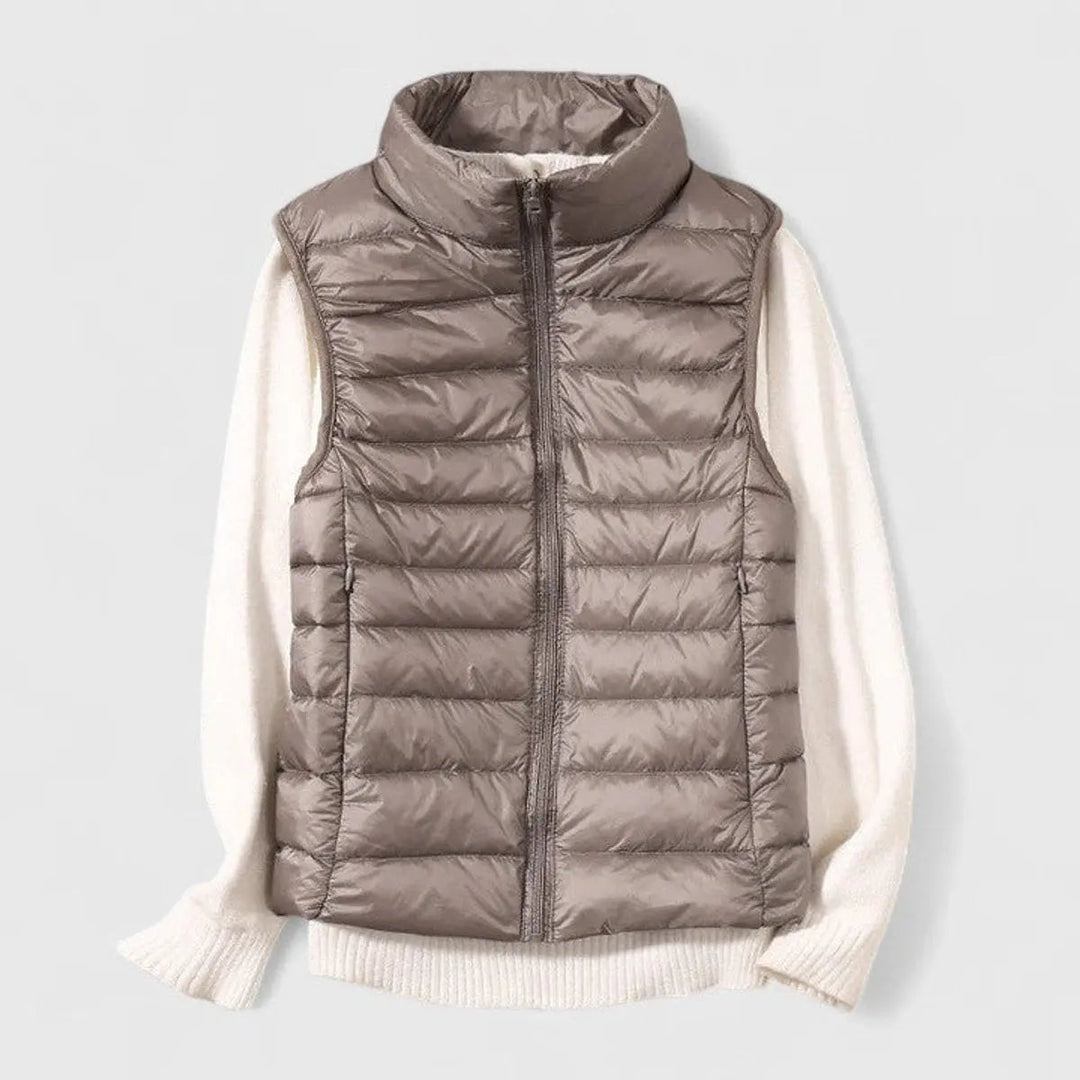 Elegant women's quilted gilet by Grace, offering a cozy, transitional autumn layer.