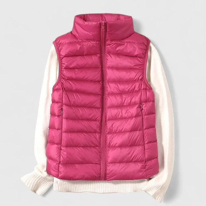 Grace women's sleeveless quilted vest for cool weather. Packable and stylish autumn layer.