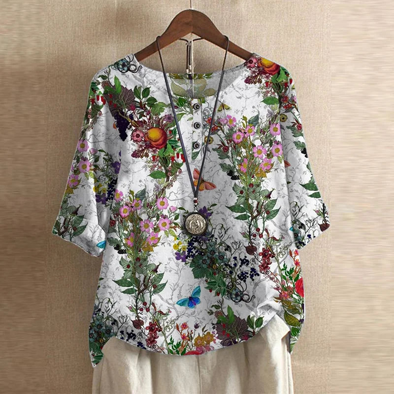 Fashion women's graphic blouse, crew neck, medium sleeve, curved hem. Stylish for casual everyday.