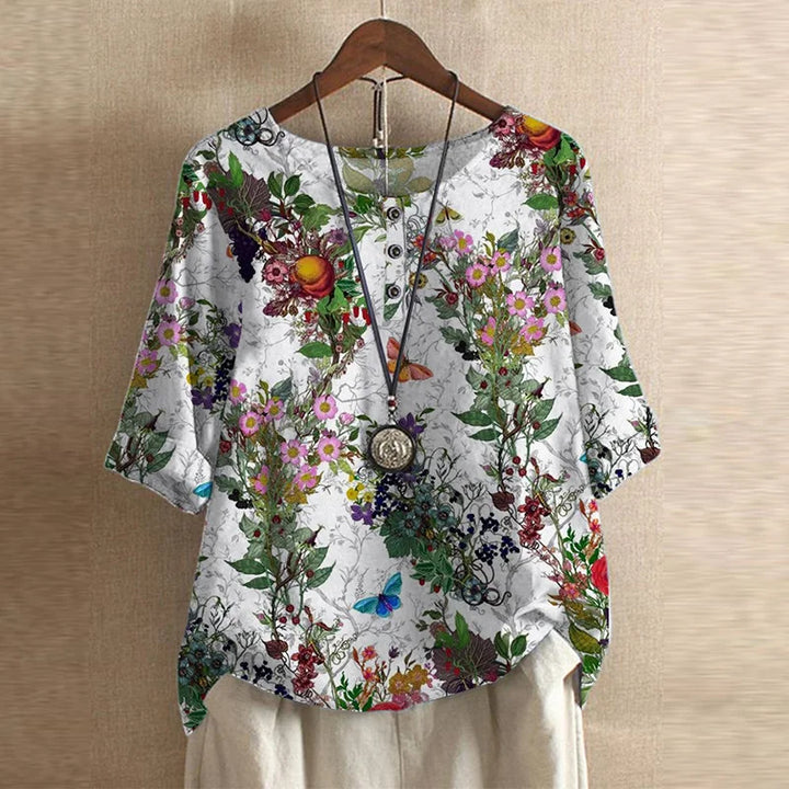 Fashion women's graphic blouse, crew neck, medium sleeve, curved hem. Stylish for casual everyday.