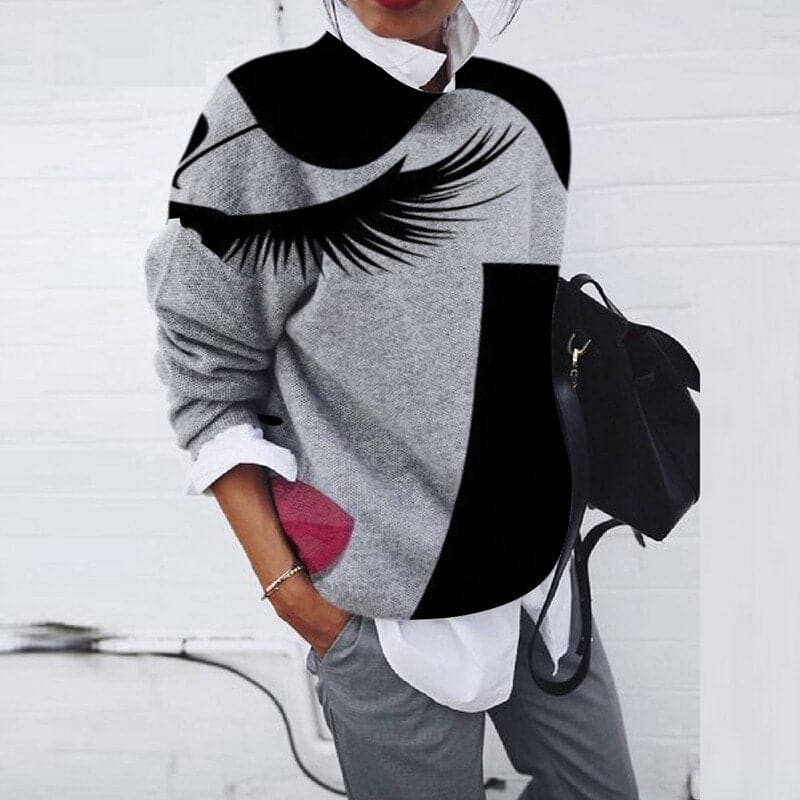 Women's graphic print crew neck sweatshirt. Relaxed fit, long sleeve, perfect for casual everyday wear in fall/winter.
