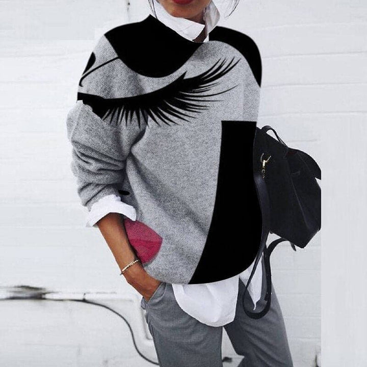 Women's graphic print crew neck sweatshirt. Relaxed fit, long sleeve, perfect for casual everyday wear in fall/winter.