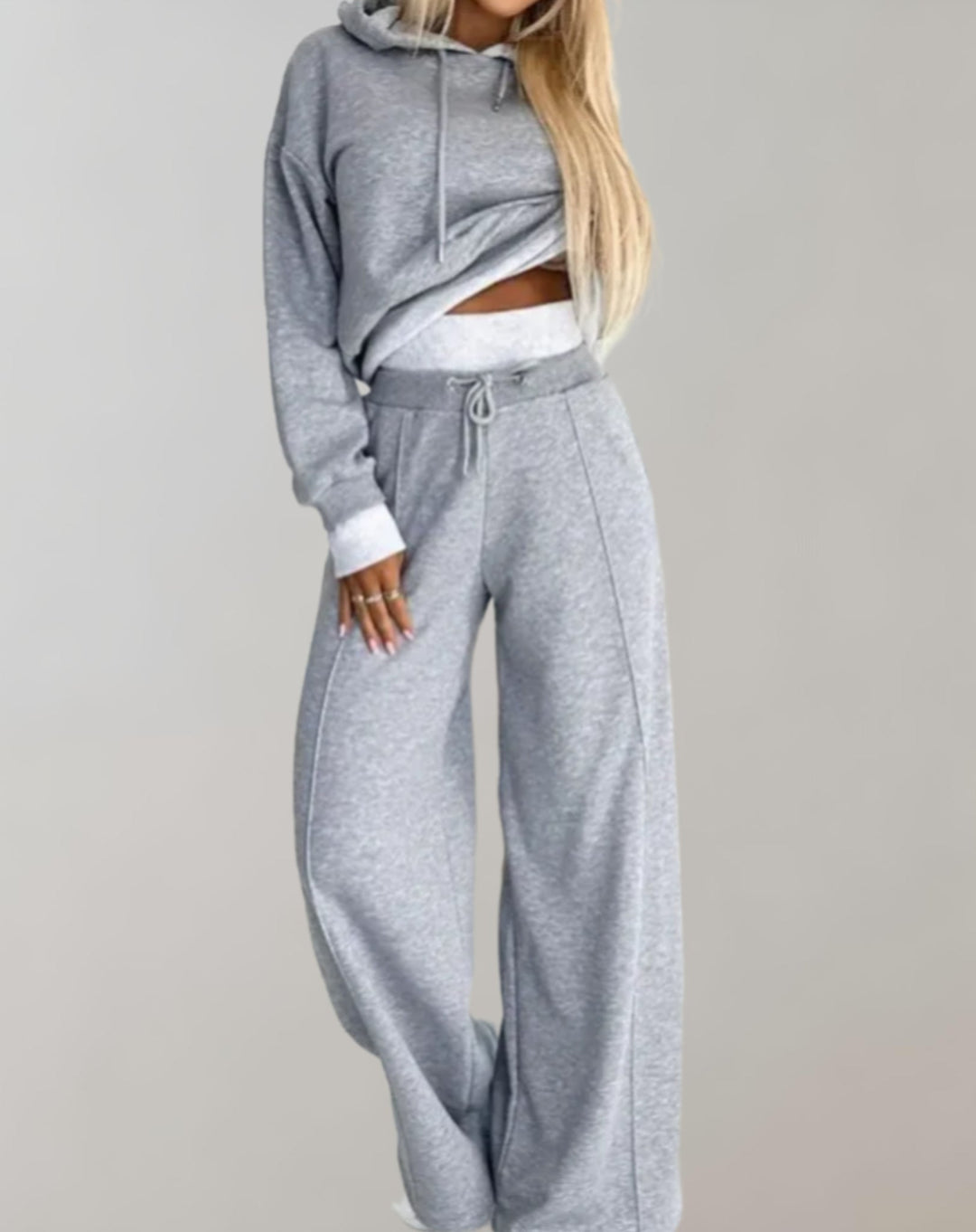 Comfortable wide leg trousers for women, designed with a relaxed fit, paired with a cropped hoodie loungewear set.