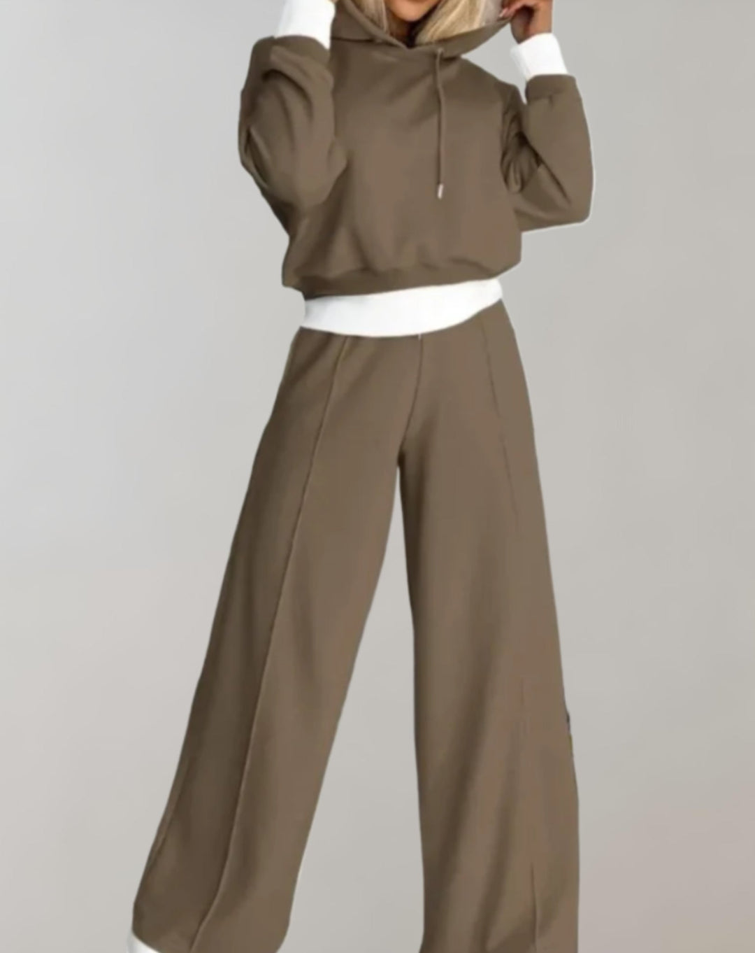 Soft women's two-piece loungewear set: cozy cropped hoodie and relaxed wide leg trousers for ultimate comfort.