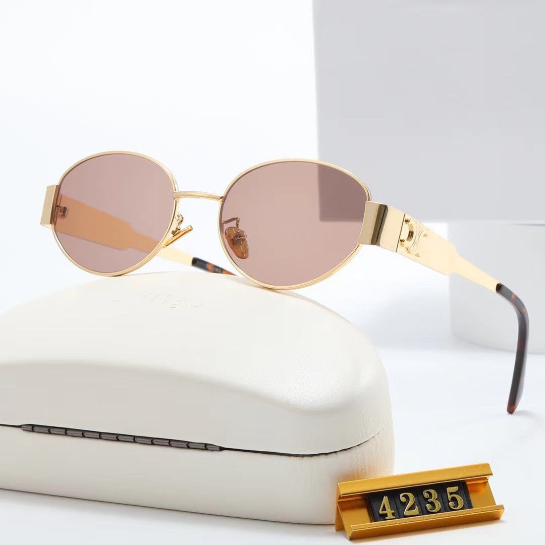 High-fashion silver oval women's sunglasses, premium designer eyewear with UV protection.