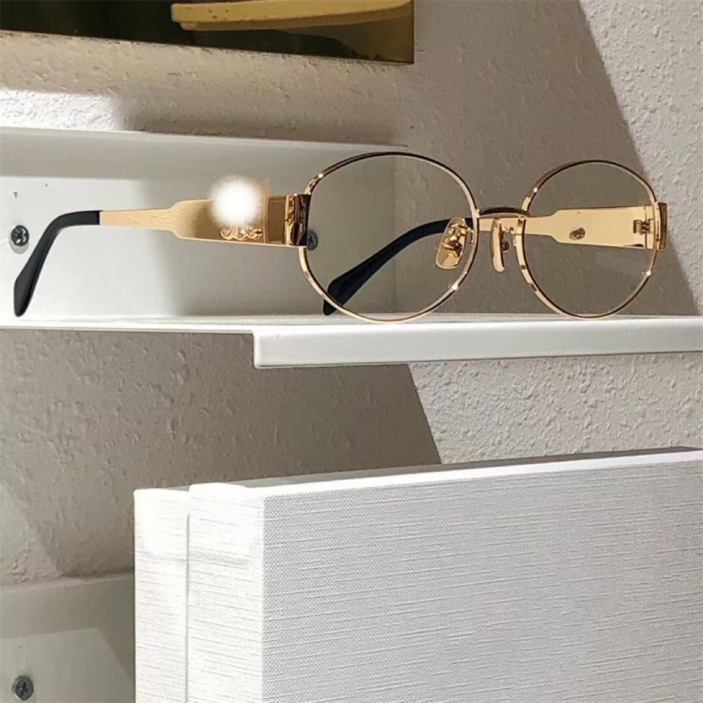 Modern gray oval designer sunglasses for women, essential UV protection eyewear accessory.