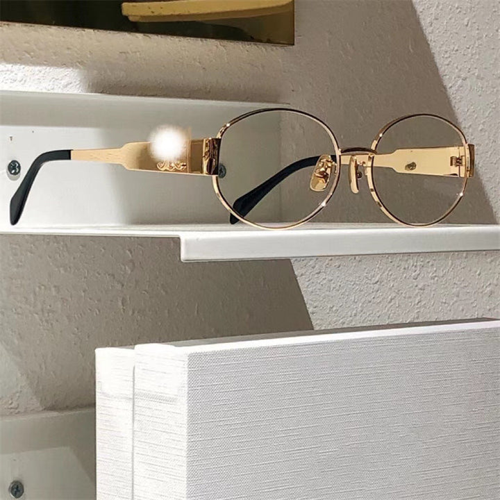 Modern gray oval designer sunglasses for women, essential UV protection eyewear accessory.