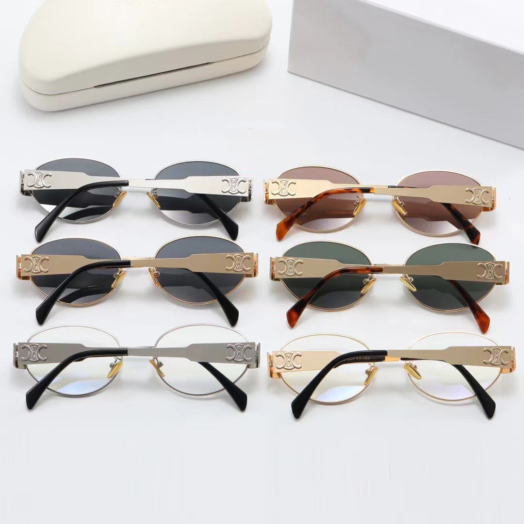 Elegant silver metallic oval sunglasses for women, stylish designer eyewear with UV protection.