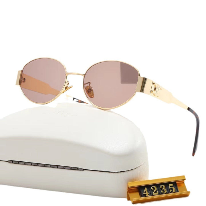 Stylish gray lens oval women's sunglasses, modern UV protection eyewear for fashion.