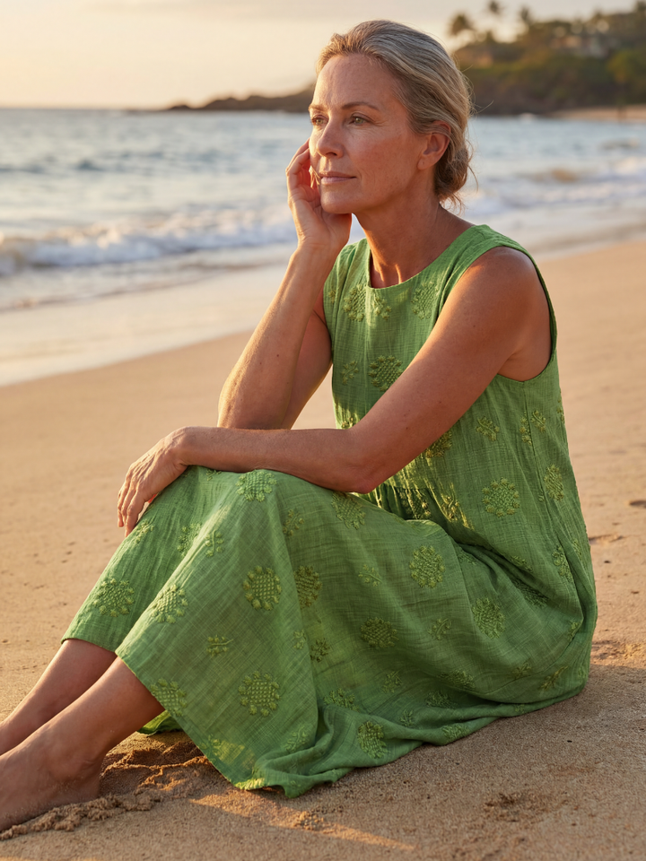 Effortless pull-on green textured midi dress for women. Sleeveless, relaxed fit, ideal for casual summer everyday wear.
