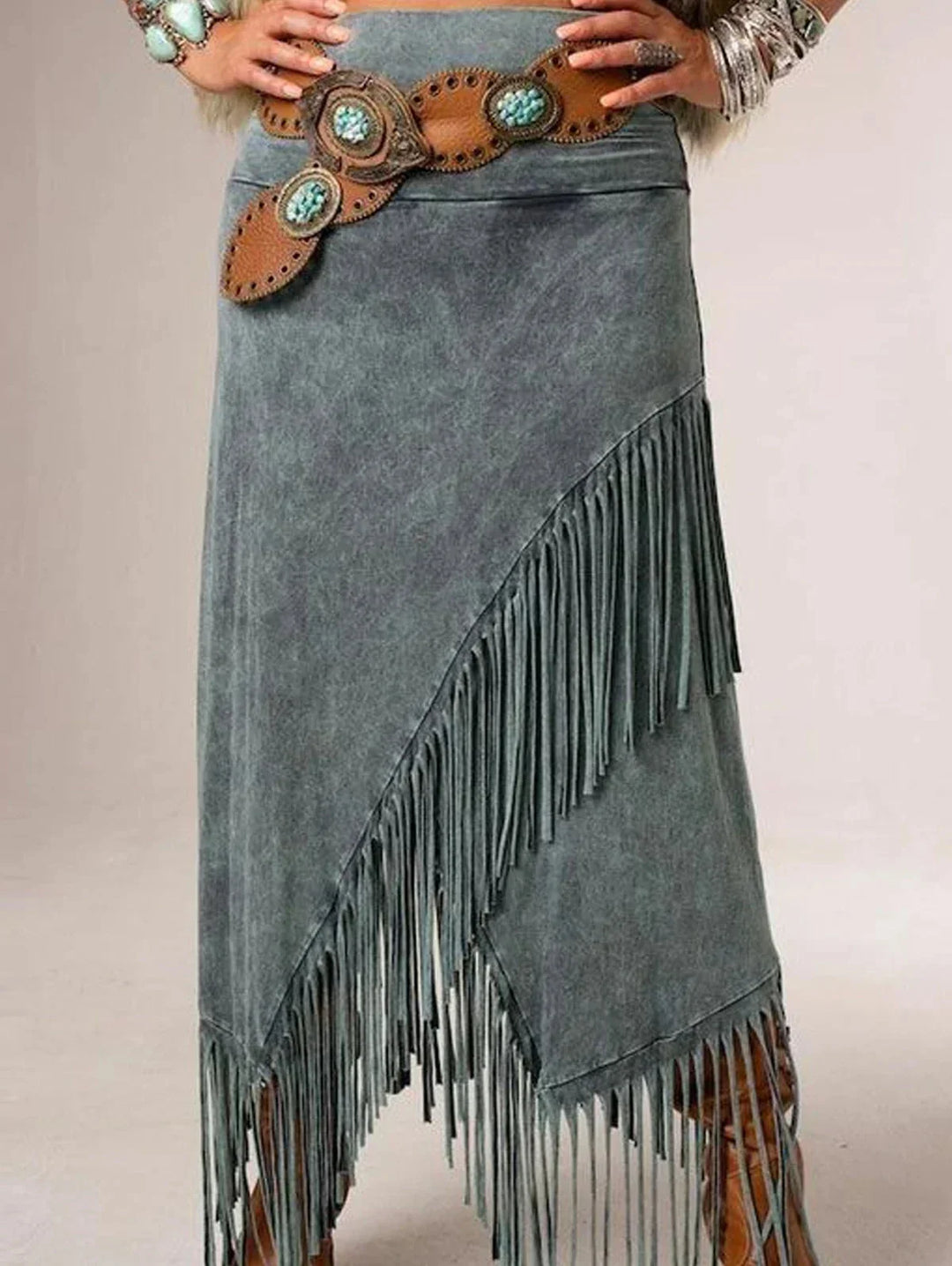 Versatile high-waisted women's grey maxi skirt featuring a unique diagonal fringe hem; ideal for casual wear.