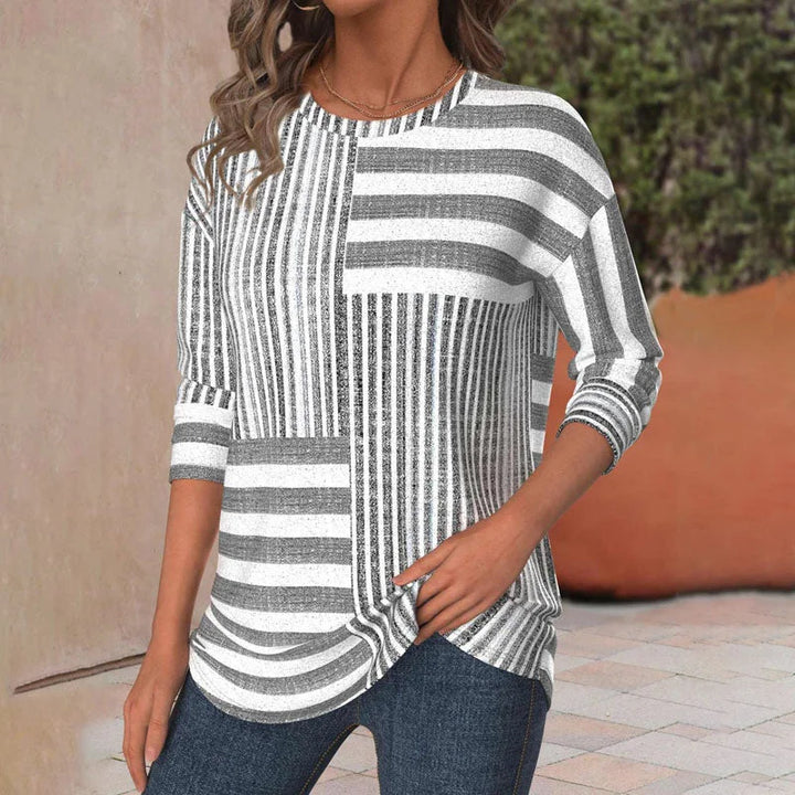 Stylish women's grey knit patchwork striped blouse with 3/4 sleeves & crew neck; perfect comfortable casual wear.