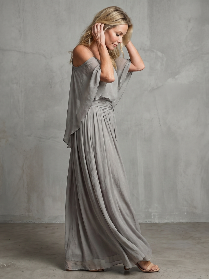 Stylish cold shoulder top with layered drape detail, part of a women's two-piece spring/summer fashion set.