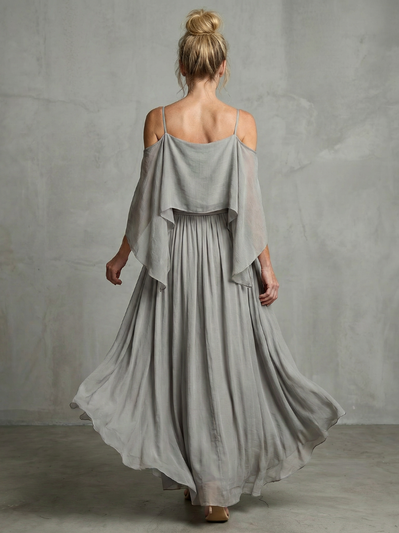 Modern women's two-piece set featuring a cold shoulder top & wide leg pants. Perfect for casual or elegant style.
