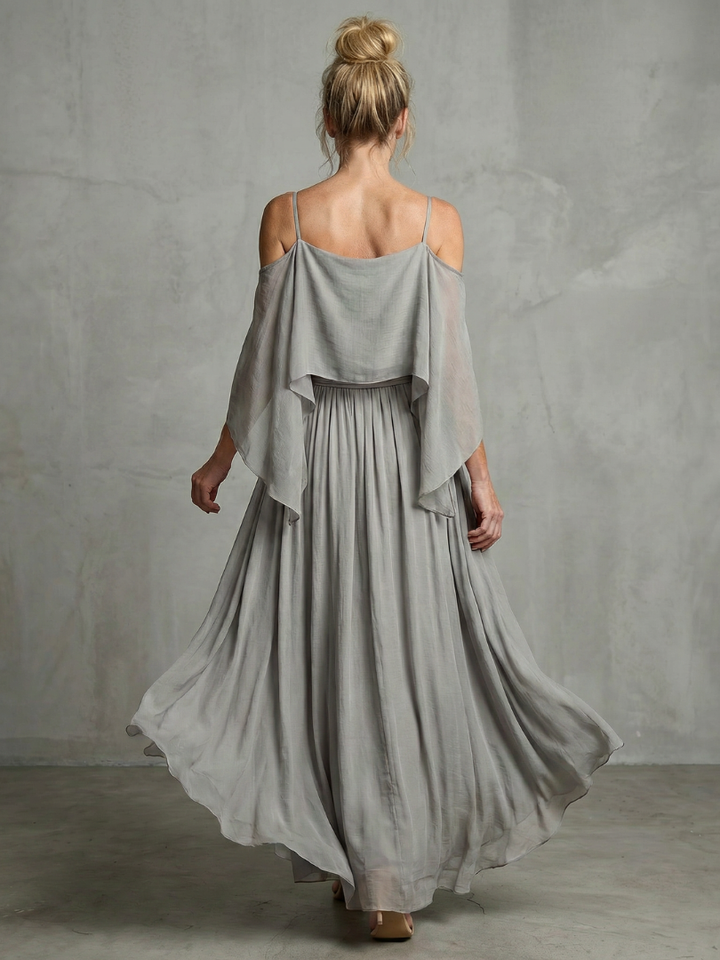 Modern women's two-piece set featuring a cold shoulder top & wide leg pants. Perfect for casual or elegant style.