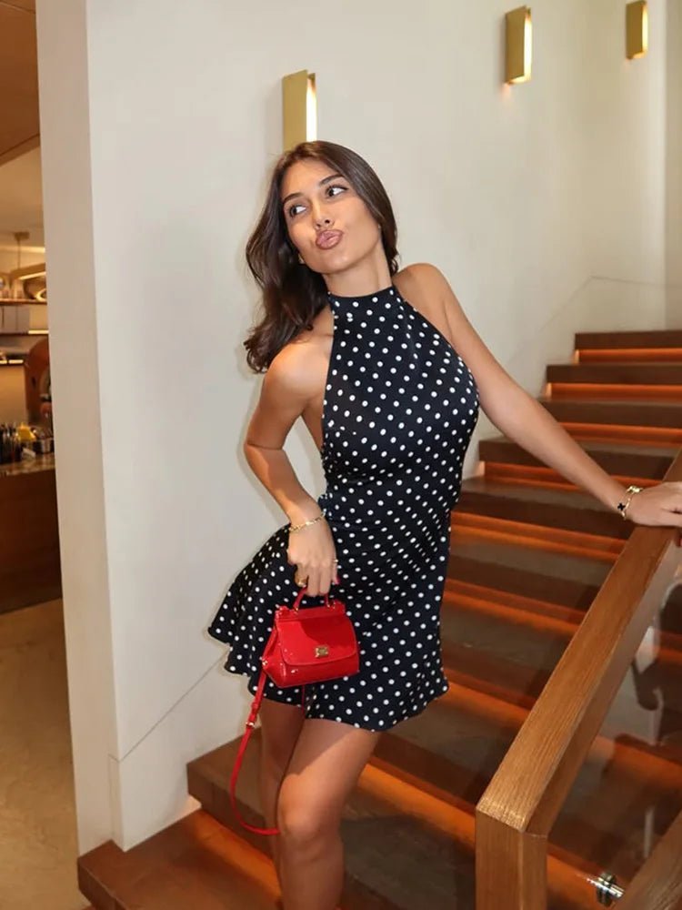 Chic women's halter neck mini dress with playful dot print. Essential for your summer casual and party dress collection.