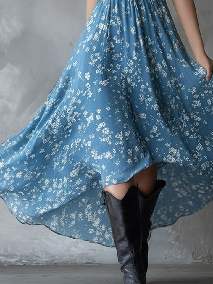 Sleeveless floral halter dress, ruched for a fitted look, with an an elegant asymmetrical hem.