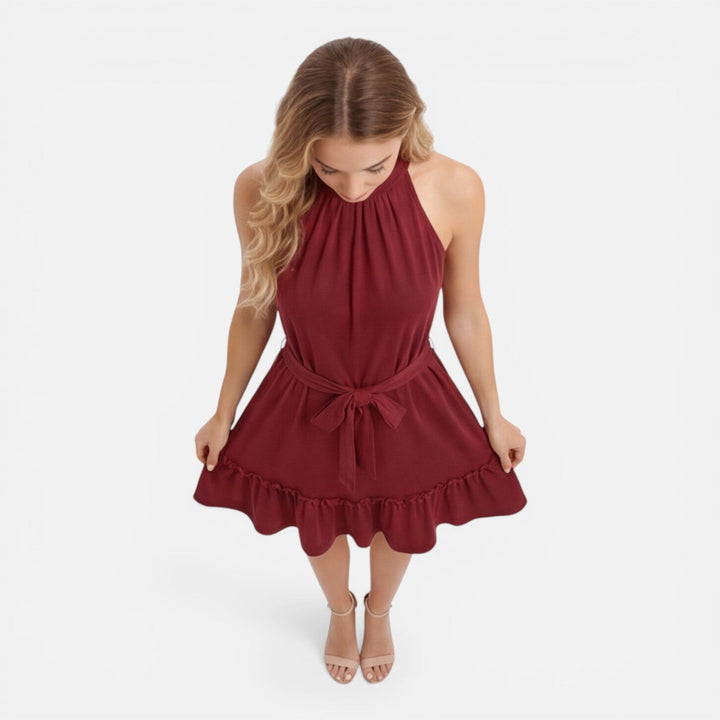 Chic women's summer halter mini dress, featuring an adjustable waist for comfort & style.