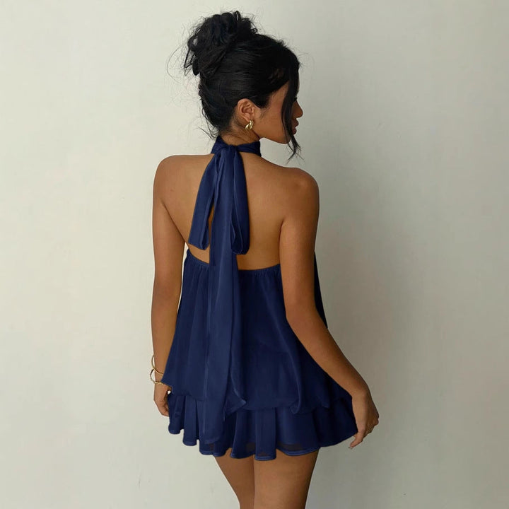Women's smart casual mini dress, sleeveless with a flattering halter neck and tiered ruffles.