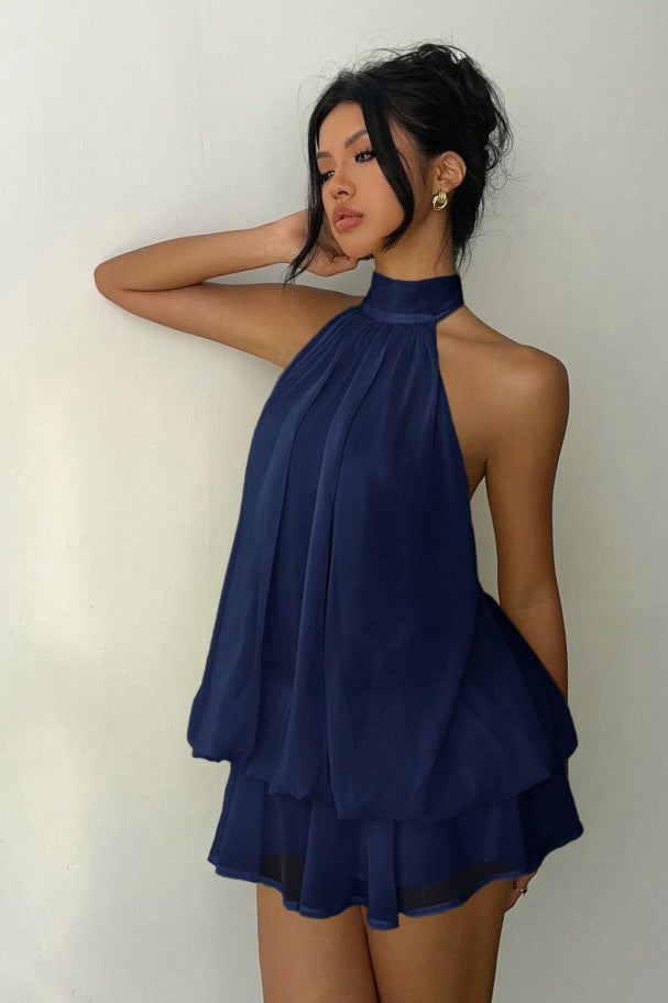 Day-to-night women's mini dress. Halter neck, tiered ruffles, an elegant party choice.