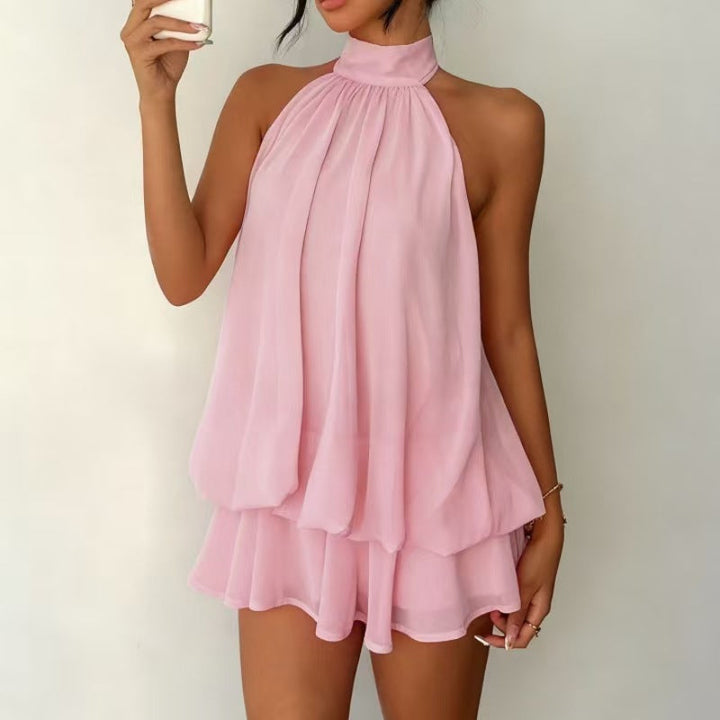 Stylish women's halter neck mini dress. Tiered ruffles create a flowy, elegant look.