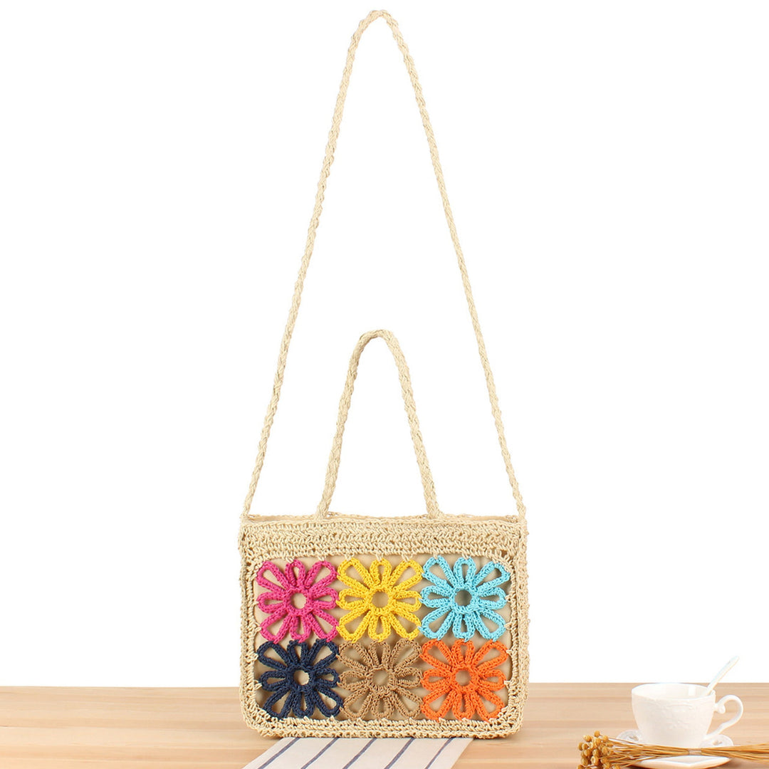 Women's handcrafted floral tote bag with vibrant design, perfect for stylish summer looks & everyday carry.