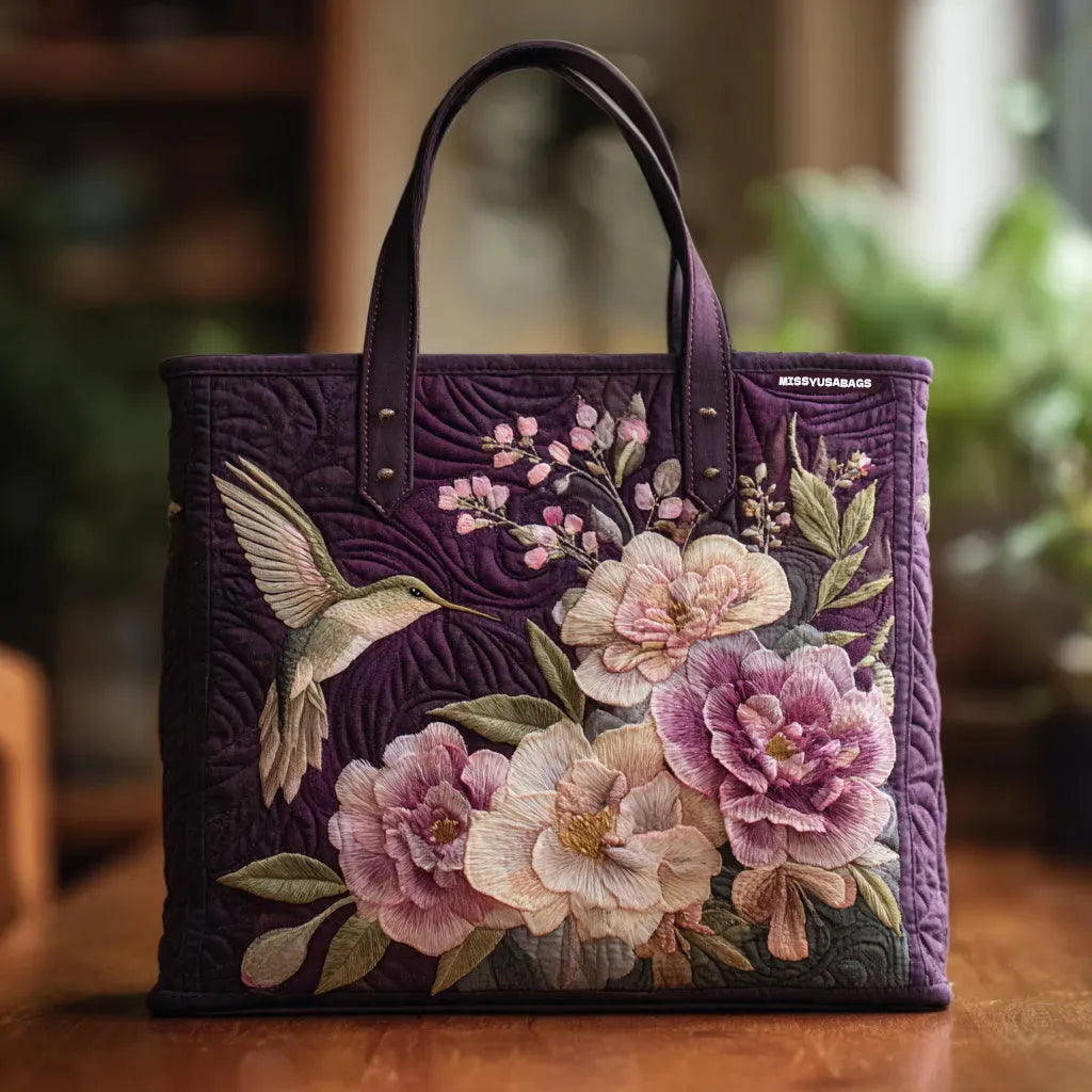 Women's handcrafted purple padded shoulder bag with beautiful hummingbird & orchid floral embroidery, unique & stylish.