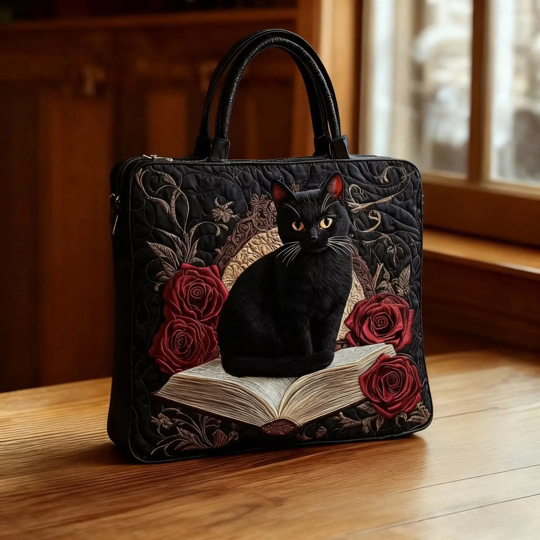 Women's handcrafted quilted tote bag with dark handles. Stylish, durable everyday shoulder bag in cotton blend.