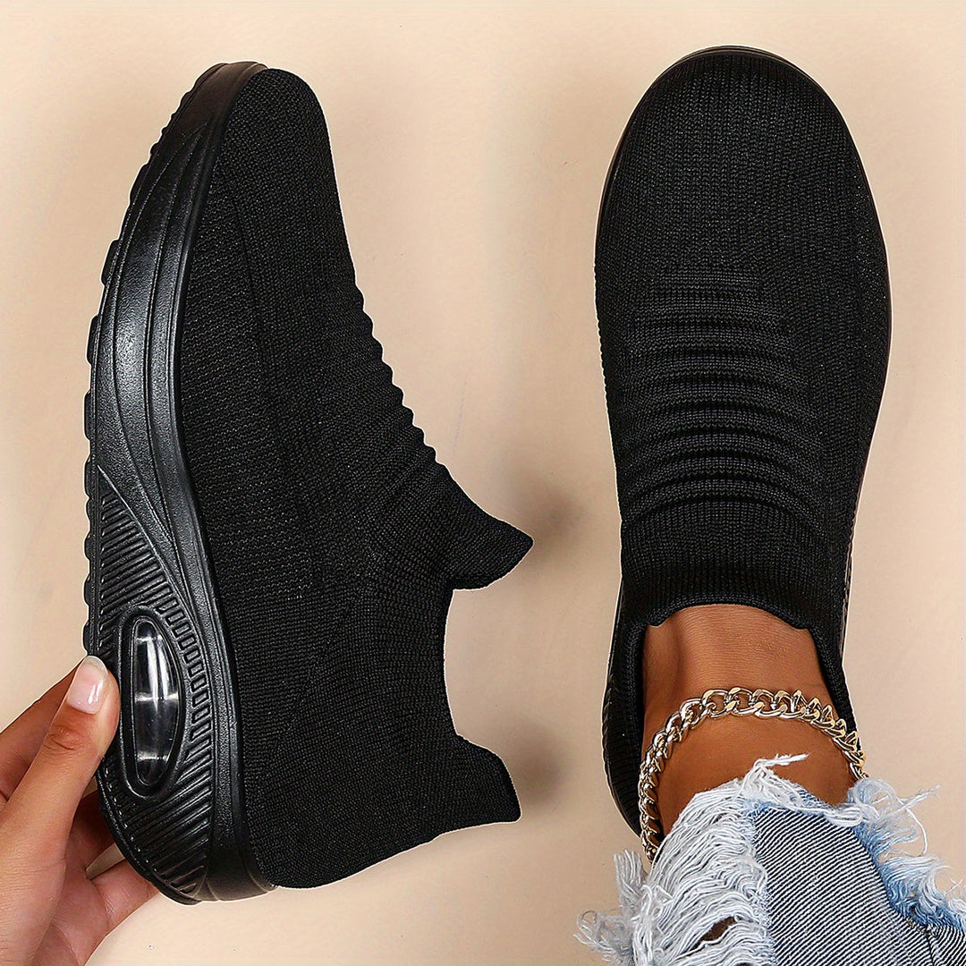 Breathable Harper wide fit women's sneakers with air cushioning for comfortable, casual wear.