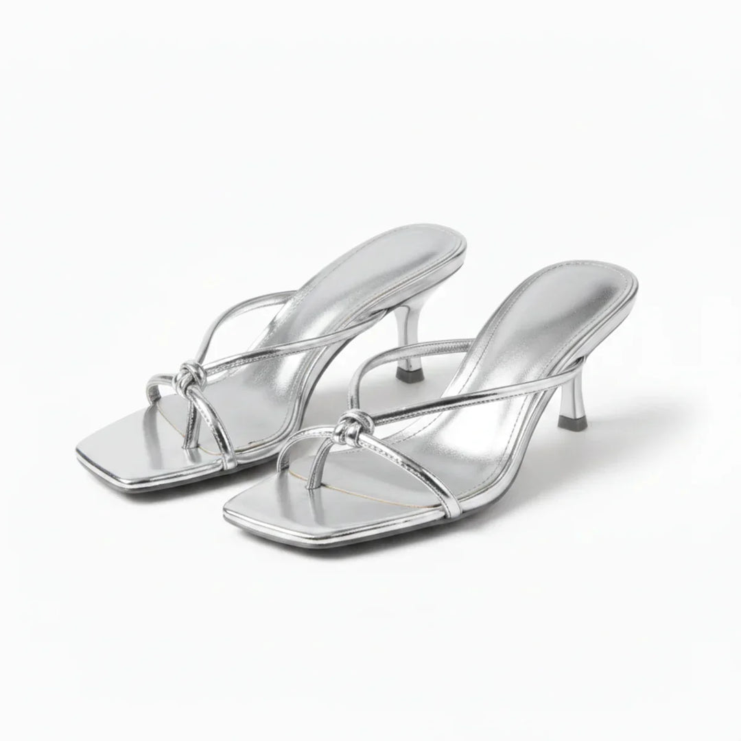 Fashionable women's sandals with heels and elegant knot design, great summer footwear.