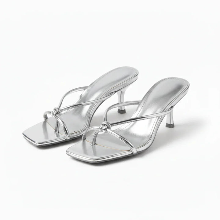 Fashionable women's sandals with heels and elegant knot design, great summer footwear.