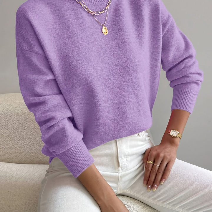 Fashion-forward women's jumper with a contemporary high neck silhouette