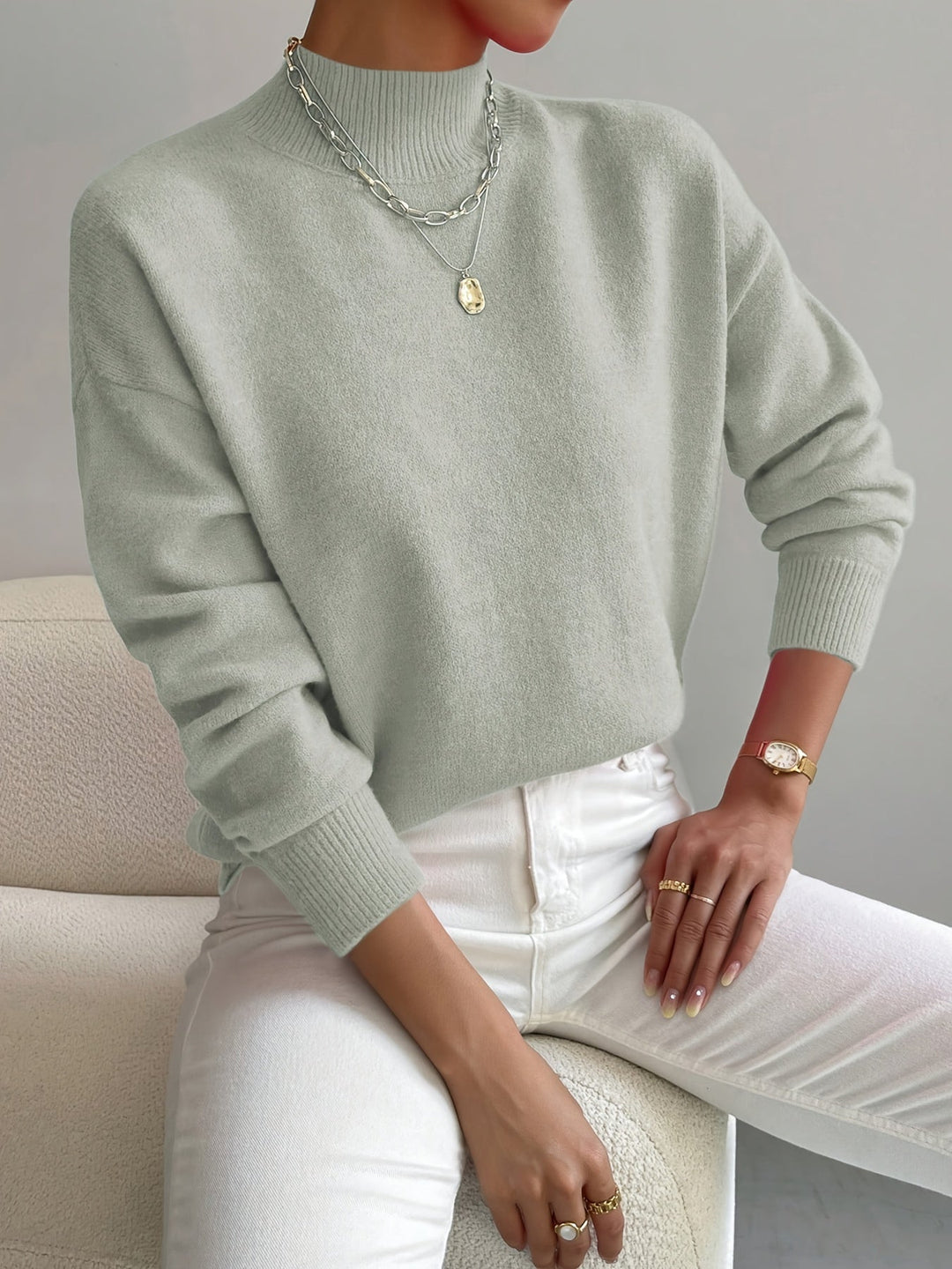 Chic ladies' knitted jumper with a classic high neck and long sleeves