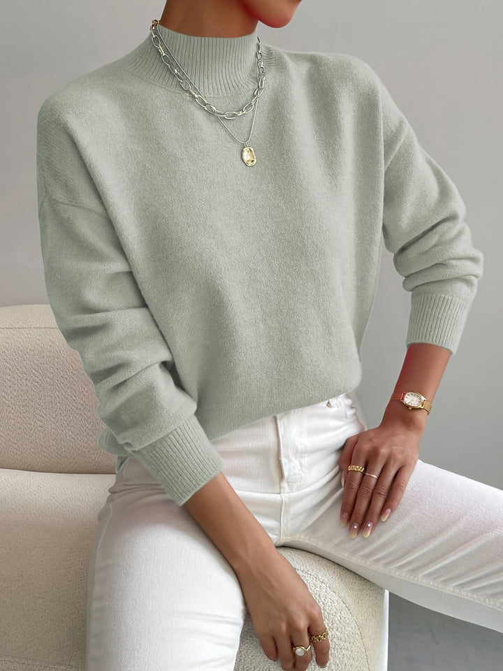 Chic ladies' knitted jumper with a classic high neck and long sleeves